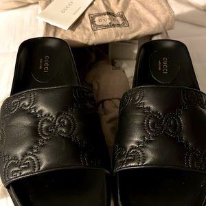 Black Gucci logo slides